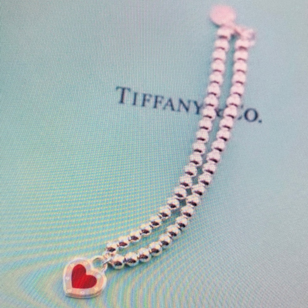 Tiffany & Co silver bead necklace with red heart charm and blue pouch